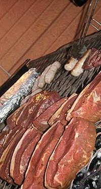 Steaks, garlic bread and fine food on the braai (BBQ), Hermanus