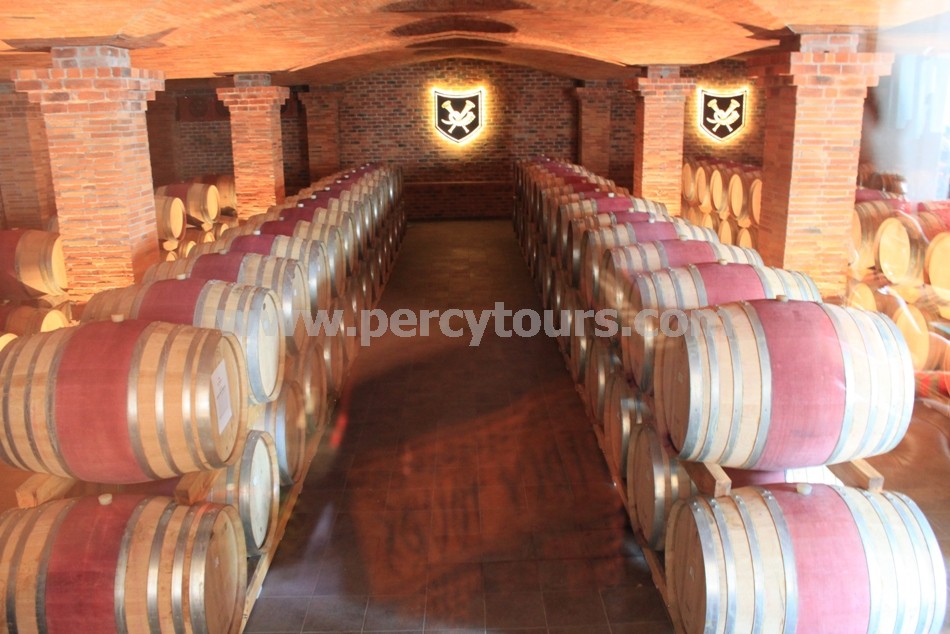 Oak wine barrels in cellar, winery, wine tours, Franschhoek and Hermanus, near Cape Town, South Africa